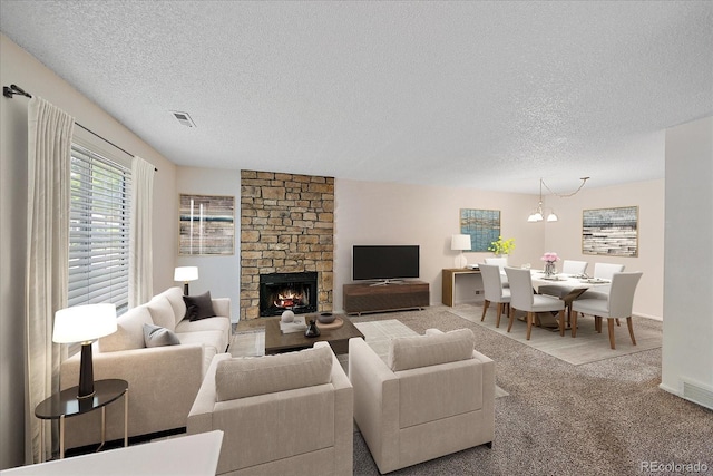 8438 Everett Way Unit B, Arvada, CO 80005 - living area with a textured ceiling, carpet floors, and a fireplace