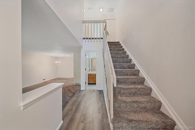8438 Everett Way Unit B, Arvada, CO 80005 - staircase with baseboards and wood finished floors