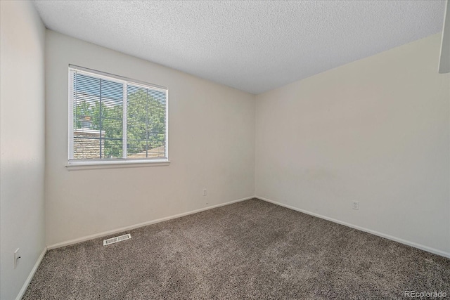 8438 Everett Way Unit B, Arvada, CO 80005 - carpeted spare room with a textured ceiling and baseboards