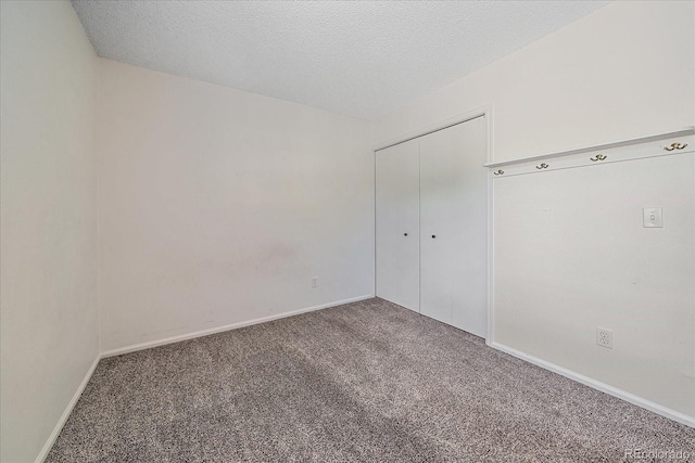 8438 Everett Way Unit B, Arvada, CO 80005 - carpeted empty room with baseboards and a textured ceiling