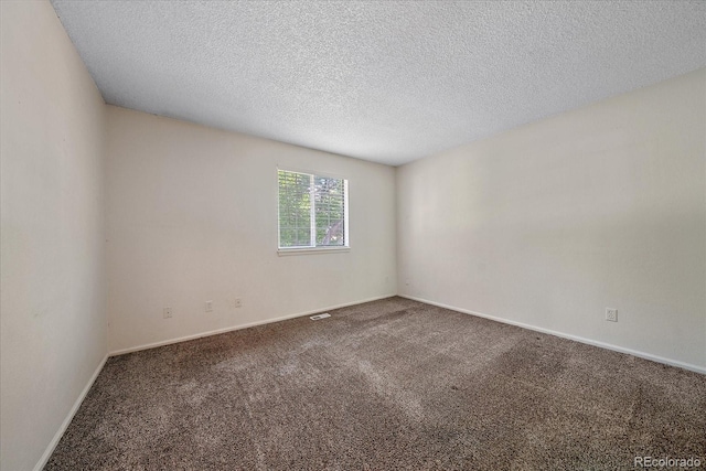 8438 Everett Way Unit B, Arvada, CO 80005 - carpeted spare room featuring a textured ceiling and baseboards
