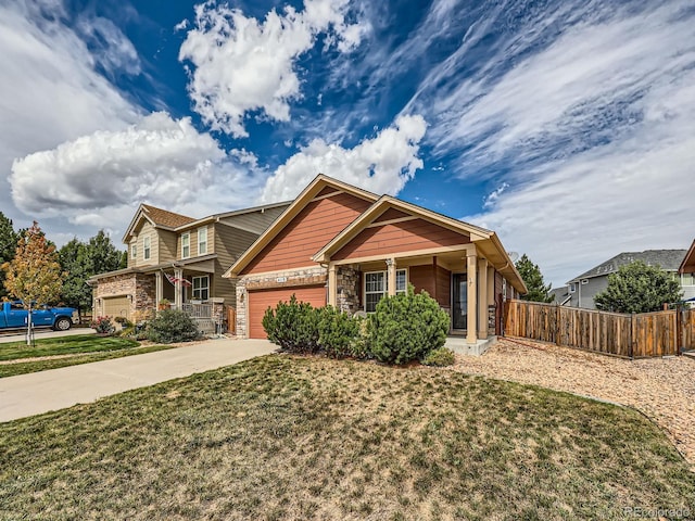 craftsman-style home with a garage and a front yard