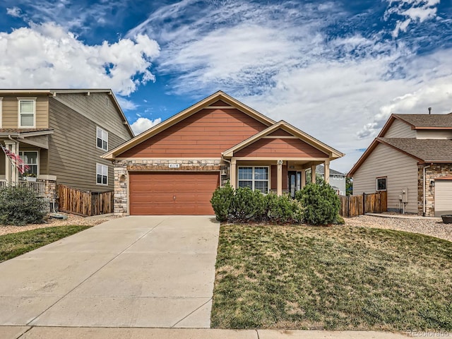 view of front of home featuring a front yard and a garage