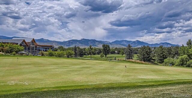 14578 W 90th Ln Unit D, Arvada, CO 80547 - view of home's community with a putting green, golf course view, and a mountain view