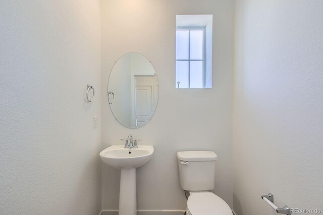 14578 W 90th Ln Unit D, Arvada, CO 80547 - bathroom with toilet and a sink