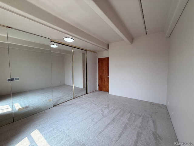 1888 S Jackson St Unit 603, Denver, CO 80210 - unfurnished bedroom with carpet and beam ceiling