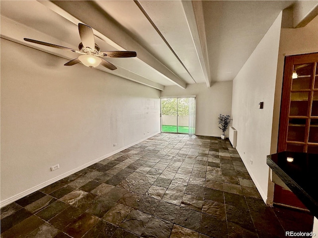 1888 S Jackson St Unit 603, Denver, CO 80210 - unfurnished living room with stone tile flooring, a ceiling fan, and beam ceiling