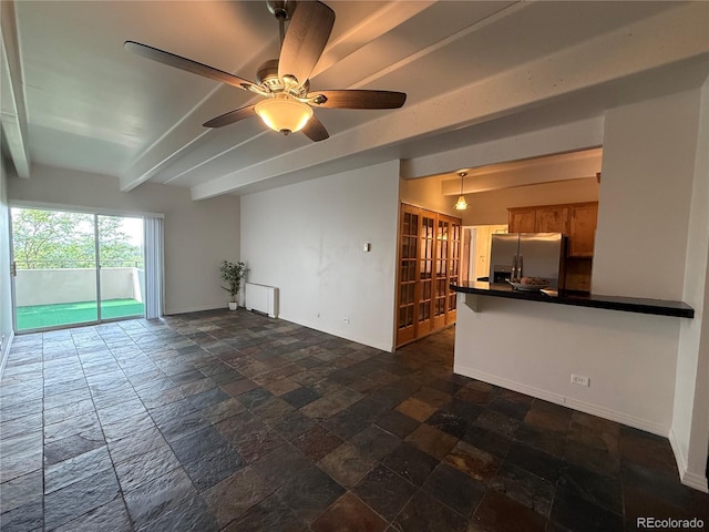 1888 S Jackson St Unit 603, Denver, CO 80210 - unfurnished living room with stone tile flooring, beam ceiling, and ceiling fan