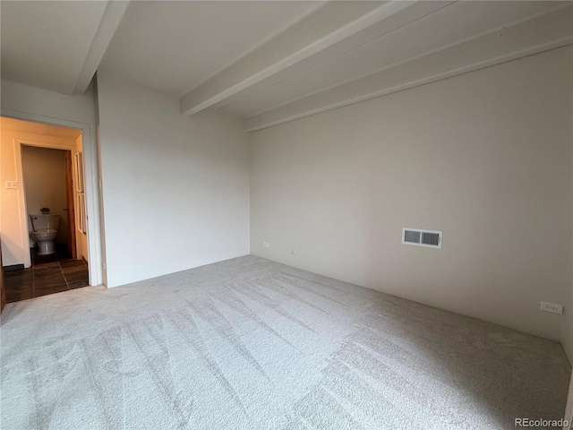 1888 S Jackson St Unit 603, Denver, CO 80210 - spare room featuring carpet and beam ceiling