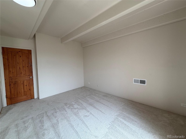 1888 S Jackson St Unit 603, Denver, CO 80210 - empty room featuring carpet floors and beam ceiling