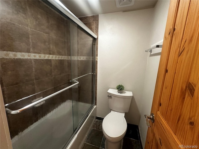 1888 S Jackson St Unit 603, Denver, CO 80210 - full bathroom featuring bath / shower combo with glass door and tile patterned floors