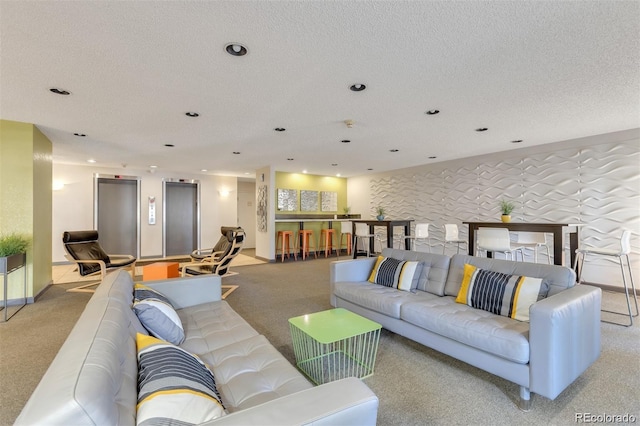 1888 S Jackson St Unit 603, Denver, CO 80210 - living area featuring carpet, recessed lighting, elevator, and a textured ceiling