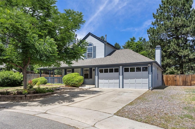 13275 W 63rd Pl, Arvada, CO 80004 - traditional-style house featuring an attached garage, concrete driveway, covered porch, roof with shingles, and a chimney