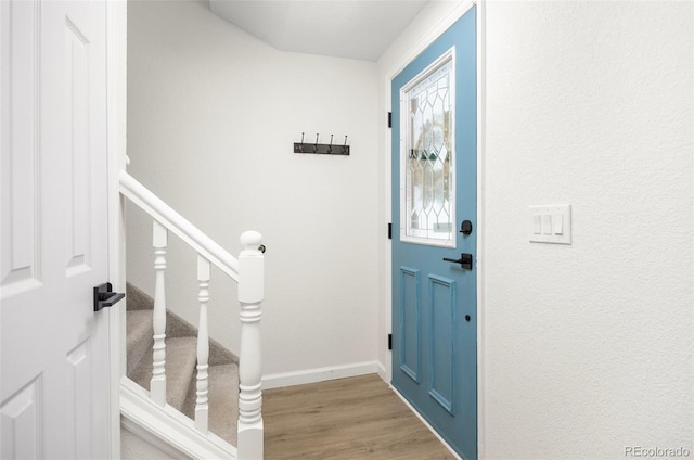 13275 W 63rd Pl, Arvada, CO 80004 - entryway featuring wood finished floors and baseboards