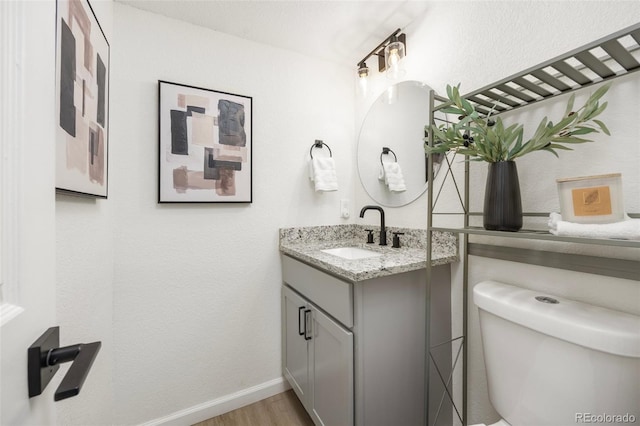 13275 W 63rd Pl, Arvada, CO 80004 - bathroom with vanity and wood finished floors