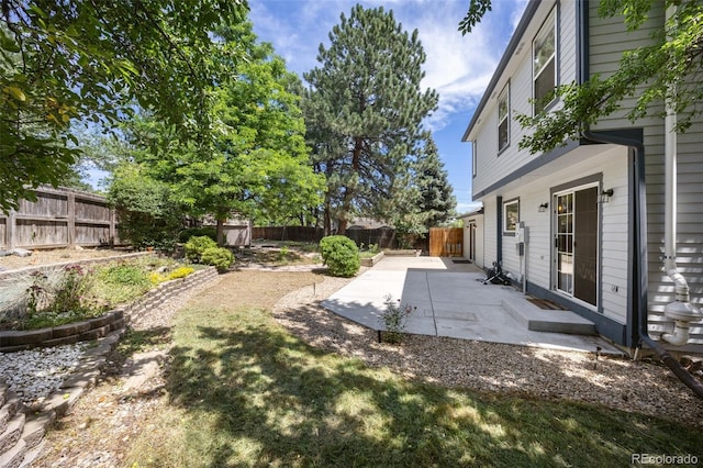 13275 W 63rd Pl, Arvada, CO 80004 - fenced backyard featuring a patio area