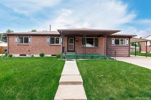 3334 W Grand Ave, Englewood, CO 80110 - view of front of house featuring a front yard, a porch, brick siding, and an attached carport
