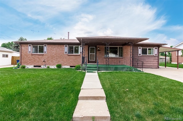 3334 W Grand Ave, Englewood, CO 80110 - view of front facade with a porch, brick siding, and a front yard