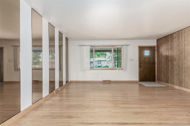 3334 W Grand Ave, Englewood, CO 80110 - entrance foyer featuring wood finished floors and wood walls