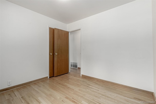 3334 W Grand Ave, Englewood, CO 80110 - spare room with light wood-style flooring and baseboards