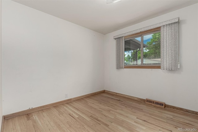 3334 W Grand Ave, Englewood, CO 80110 - unfurnished room with wood finished floors and baseboards