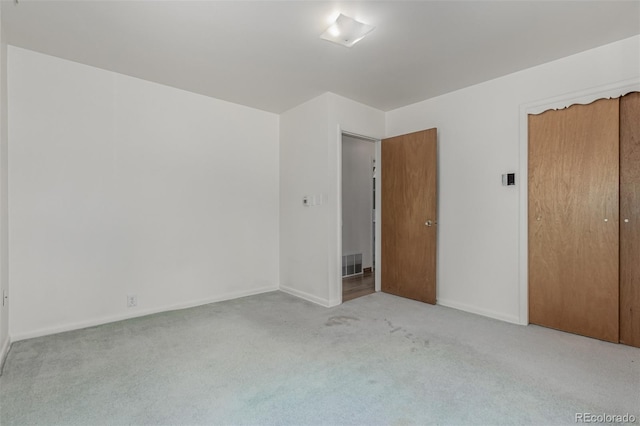 3334 W Grand Ave, Englewood, CO 80110 - unfurnished bedroom with carpet flooring and a closet