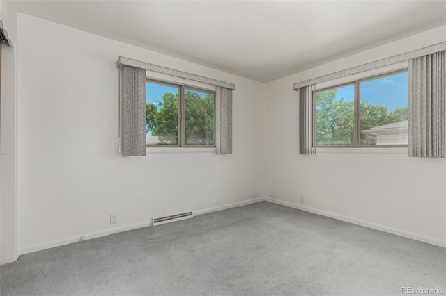 3334 W Grand Ave, Englewood, CO 80110 - carpeted empty room featuring plenty of natural light