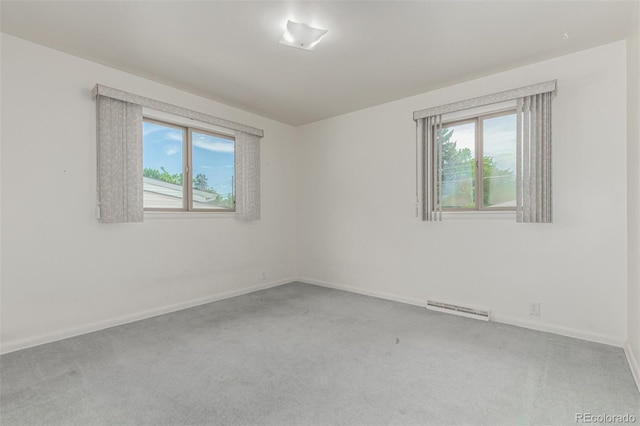 3334 W Grand Ave, Englewood, CO 80110 - carpeted spare room featuring baseboards