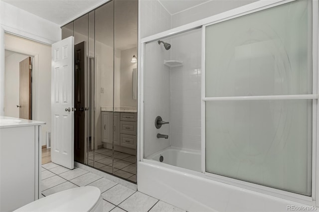 3334 W Grand Ave, Englewood, CO 80110 - full bath with vanity, tile patterned floors, and combined bath / shower with glass door