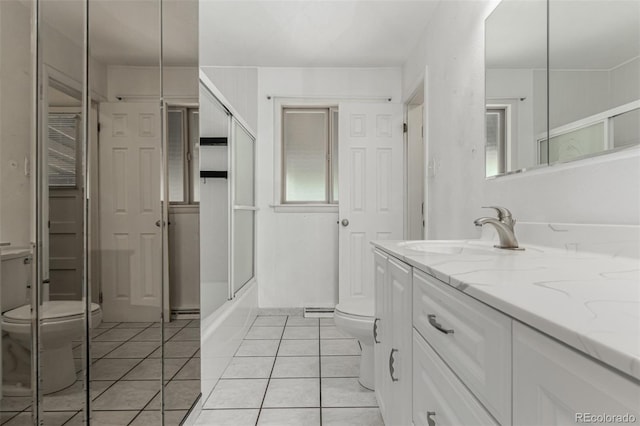 3334 W Grand Ave, Englewood, CO 80110 - bathroom with vanity, tile patterned flooring, and a closet