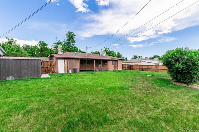 3334 W Grand Ave, Englewood, CO 80110 - rear view of property featuring a chimney and brick siding