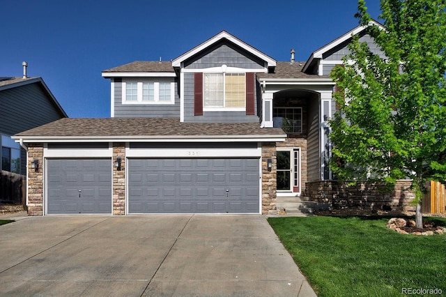 view of front facade featuring concrete driveway, stone siding, and roof with shingles