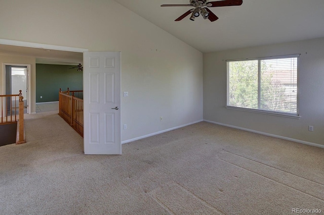 unfurnished room featuring a ceiling fan, carpet, baseboards, and high vaulted ceiling