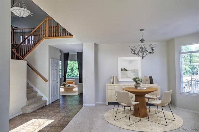 331 Las Lomas St, Brighton, CO 80601 - dining area with stairs, a chandelier, and baseboards