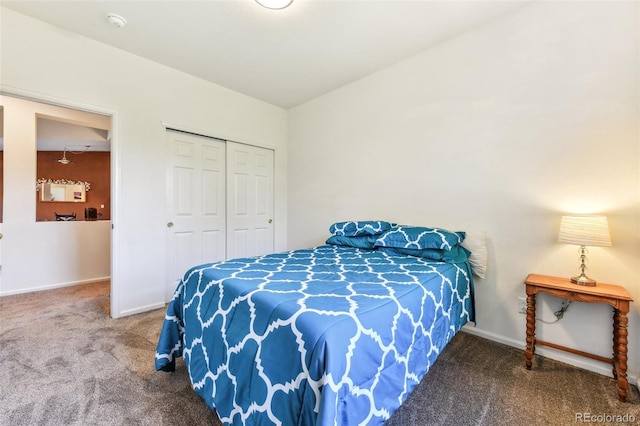 carpeted bedroom featuring vaulted ceiling and a closet