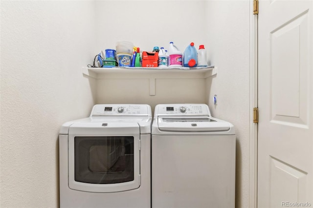 laundry room with washing machine and clothes dryer