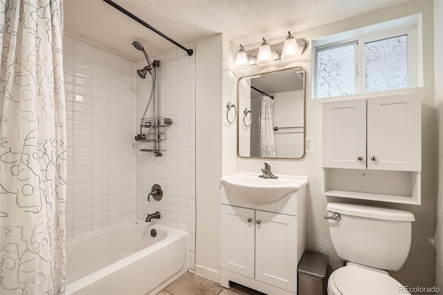 full bathroom with shower / tub combo with curtain, vanity, toilet, and a textured ceiling