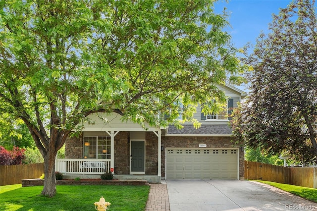 14794 Vine St, Thornton, CO 80602 - view of front of home with concrete driveway, covered porch, a garage, and stone siding