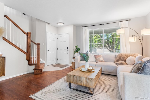 14794 Vine St, Thornton, CO 80602 - living room featuring wood finished floors, stairs, and baseboards