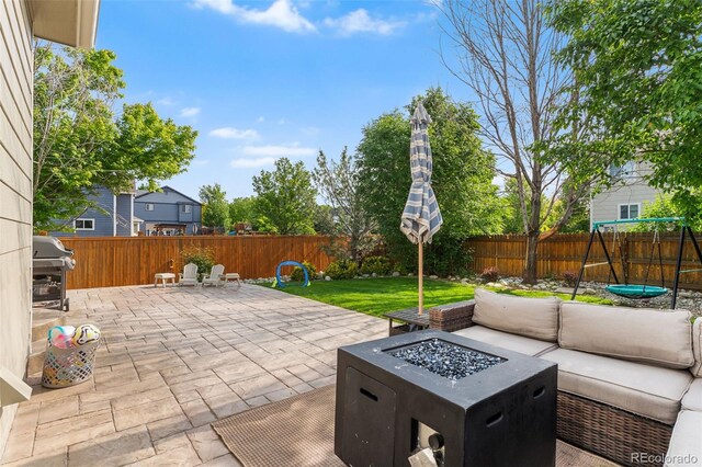 14794 Vine St, Thornton, CO 80602 - fenced backyard featuring a patio area, an outdoor living space with a fire pit, and area for grilling