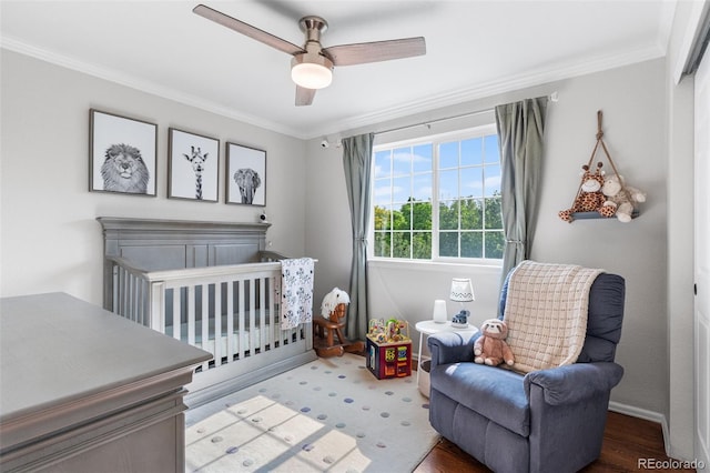 14794 Vine St, Thornton, CO 80602 - bedroom featuring a nursery area, ornamental molding, baseboards, and a ceiling fan