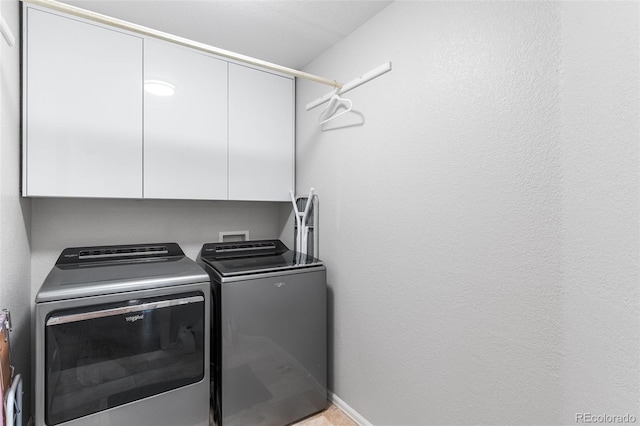 14794 Vine St, Thornton, CO 80602 - laundry room featuring cabinet space, washer and clothes dryer, and baseboards