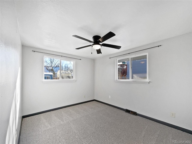 carpeted empty room with ceiling fan