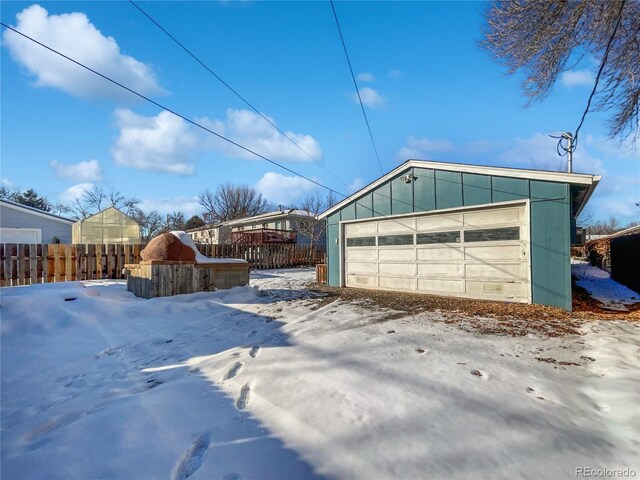 view of snow covered garage