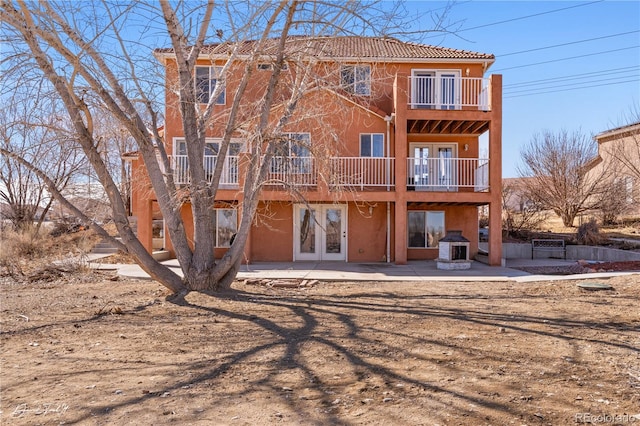25 Tierra Casa Dr, Pueblo, CO 81005 - back of property featuring french doors, a balcony, and a patio