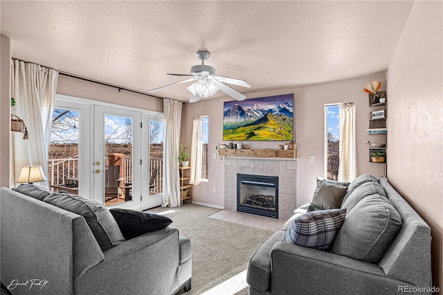 25 Tierra Casa Dr, Pueblo, CO 81005 - carpeted living room featuring french doors, ceiling fan, a fireplace, and a textured ceiling