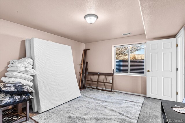 25 Tierra Casa Dr, Pueblo, CO 81005 - bedroom with light carpet and a textured ceiling