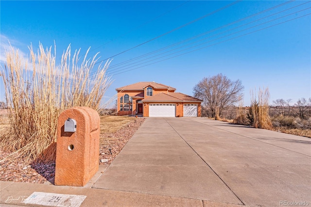 25 Tierra Casa Dr, Pueblo, CO 81005 - view of front of property featuring a garage