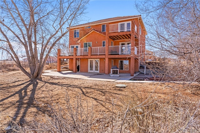 25 Tierra Casa Dr, Pueblo, CO 81005 - rear view of property with a patio area, french doors, and a balcony