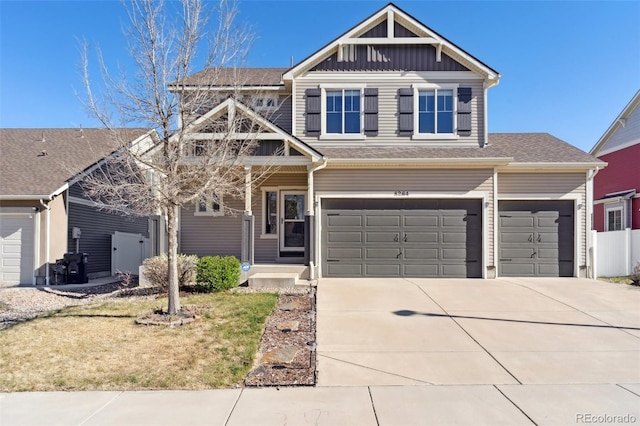 view of front of property featuring a garage, board and batten siding, and concrete driveway